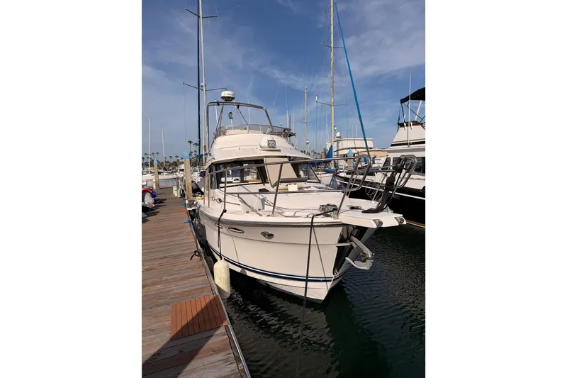 Slide: The Image of 2021 Cutwater C-32 CB yacht docked at sunset harbor. - 80