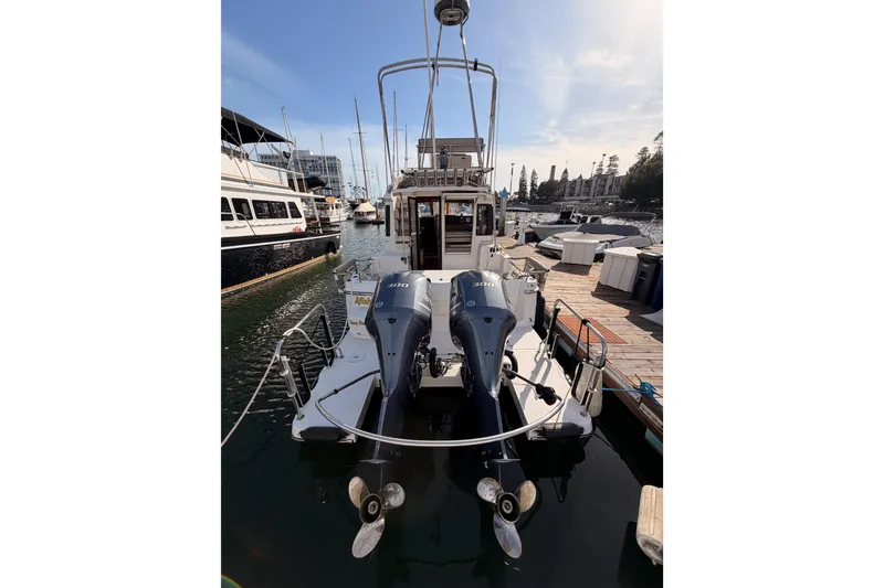 Slide: The Image of 2021 Cutwater C-32 CB yacht docked at marina, showcasing sleek design and spacious deck. - 9