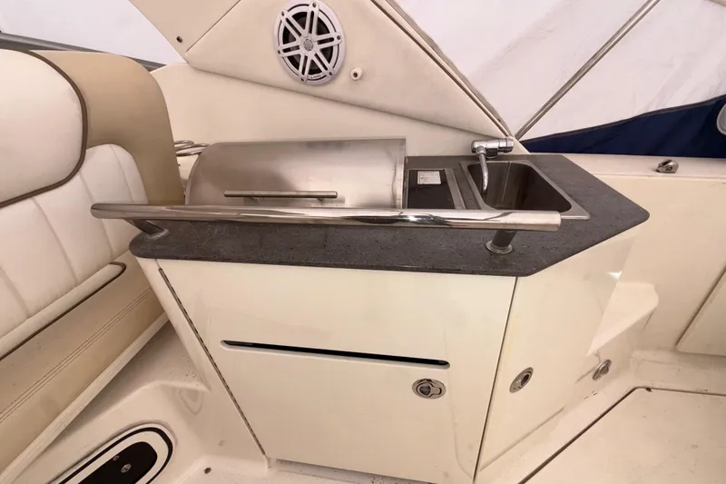Slide: The Image of Outdoor kitchenette on 2012 Sea Ray Sundancer 310 yacht with grill and sink. - 14