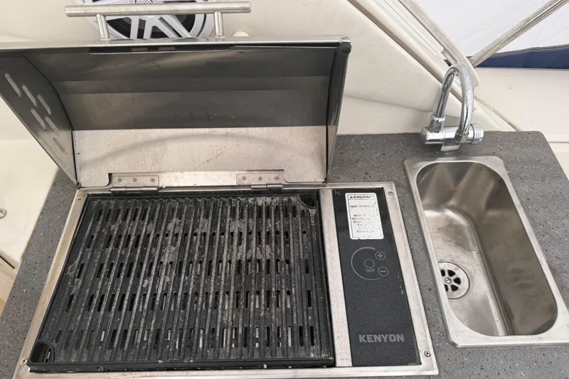 Slide: The Image of Outdoor grill and sink on a 2012 Sea Ray Sundancer 310 yacht. - 15