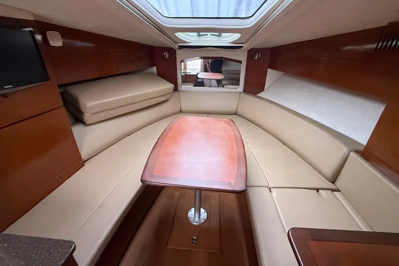 Slide: The Image of Luxurious interior of 2012 Sea Ray Sundancer 310 yacht with elegant seating and table. - 21