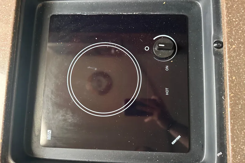 Slide: The Image of Built-in Kenyon stove on 2012 Sea Ray Sundancer 310 yacht. - 25