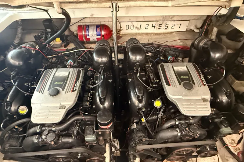 Slide: The Image of Twin engines in a 2012 Sea Ray Sundancer 310 boat engine compartment. - 35