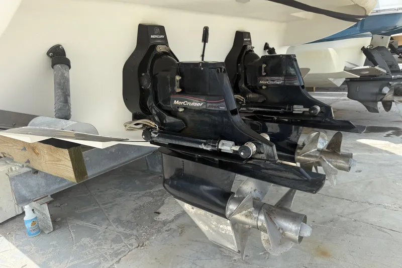 Slide: The Image of Twin MerCruiser engines on a 2012 Sea Ray Sundancer 310 boat, showcasing propellers. - 36