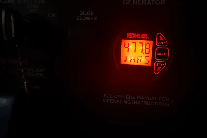 Slide: The Image of Kohler generator display showing 477.8 hours on a 2012 Sea Ray Sundancer 310. - 37