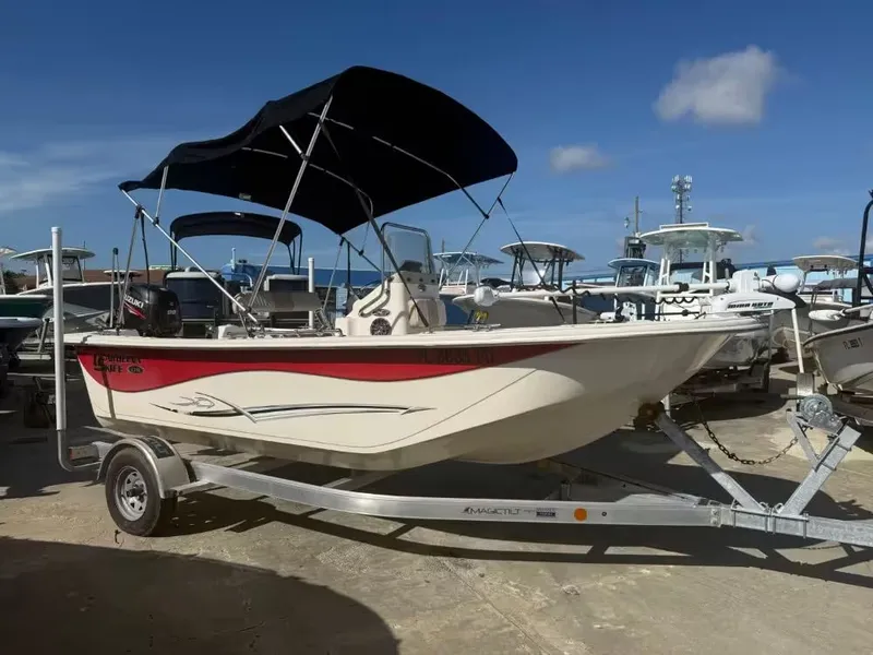 The Image of 2014 Carolina Skiff 178 DVL boat on trailer at marina. - 1