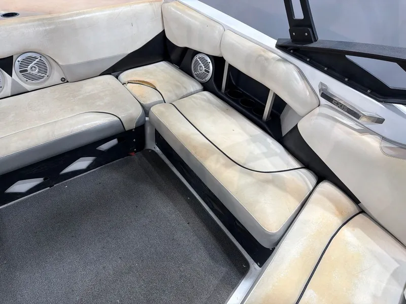 Slide: The Image of Interior of a 2011 Axis A20 boat with worn seating. - 10