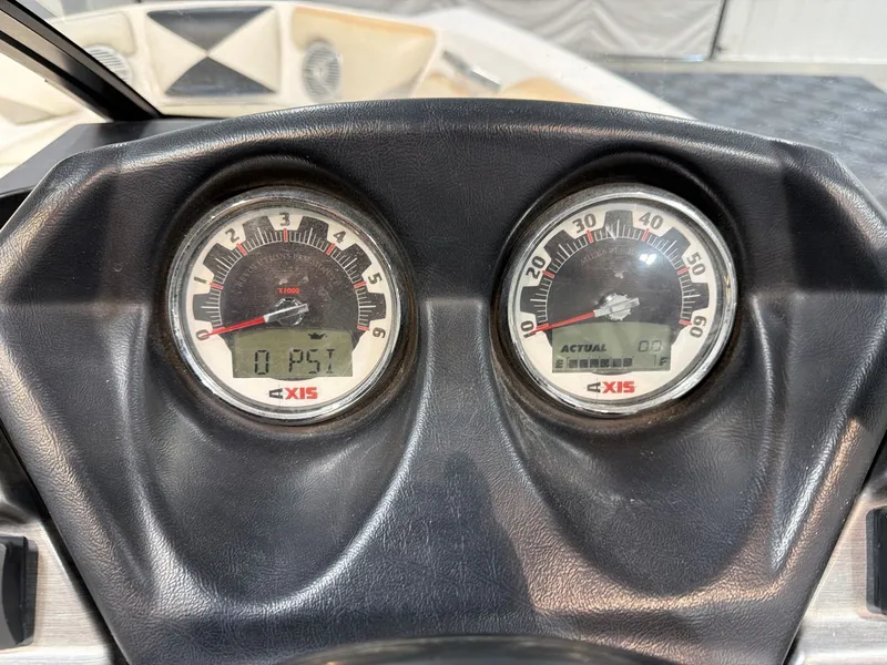 Slide: The Image of Dashboard of a 2011 Axis A20 boat with gauges. - 15