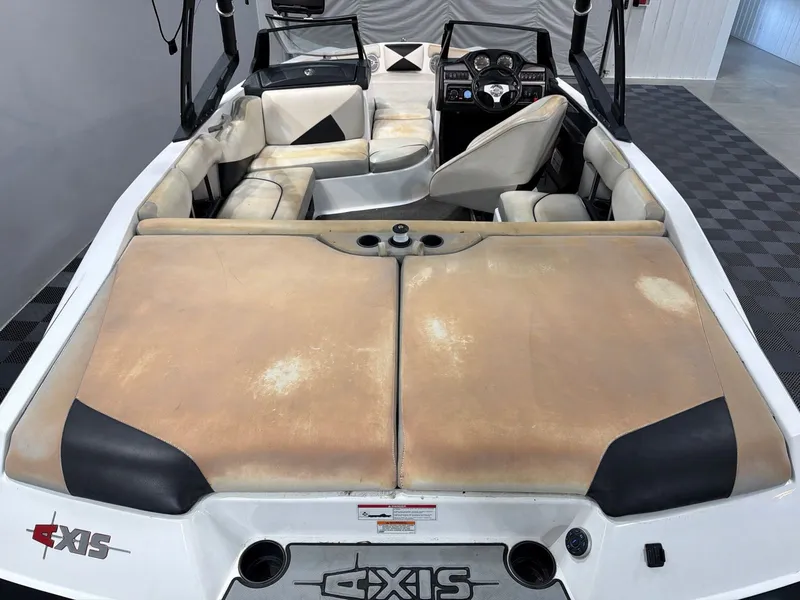 Slide: The Image of Interior of a 2011 Axis A20 boat with worn seats. - 6