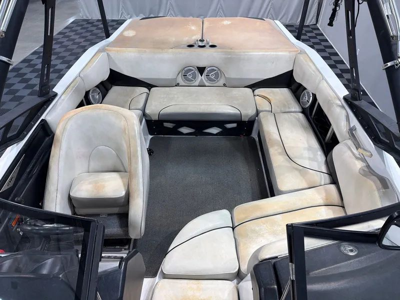 Slide: The Image of Interior of a 2011 Axis A20 boat with worn seats. - 8