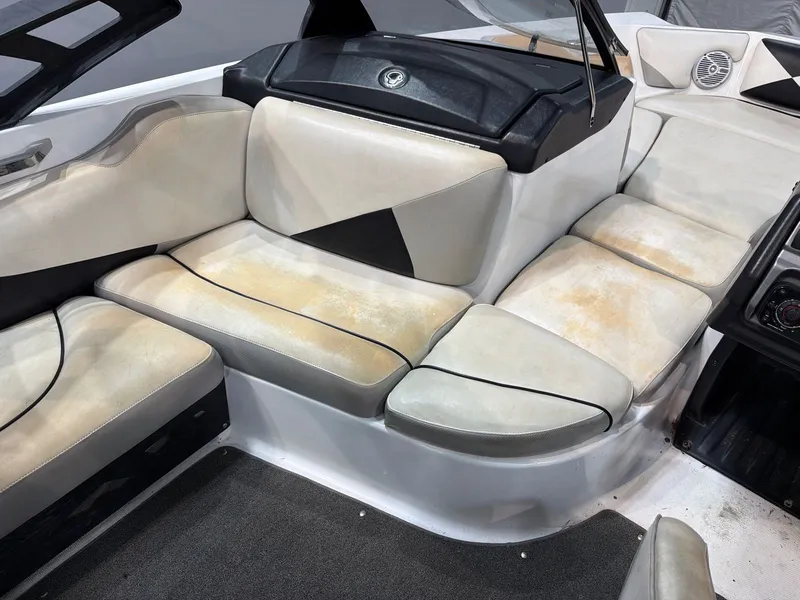 Slide: The Image of Interior of a 2011 Axis A20 boat with worn seats. - 9