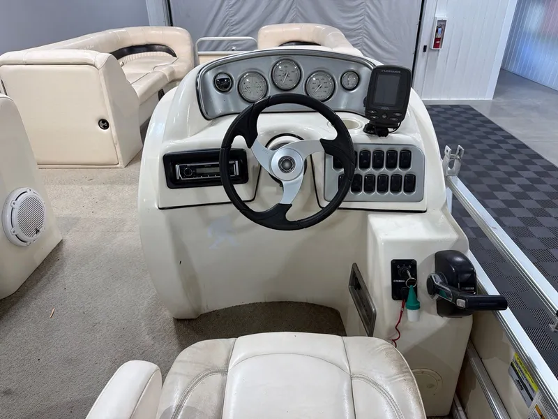 Slide: The Image of Interior view of a 2007 Godfrey Aqua Patio 240RE boat. - 12