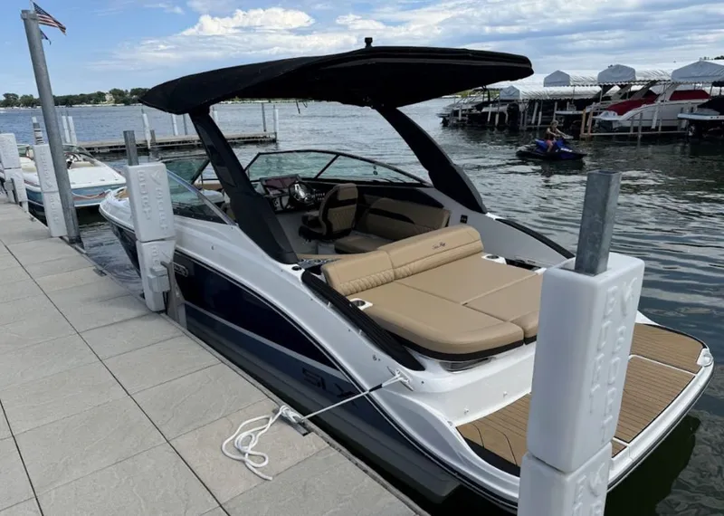 Slide: The Image of 2020 Sea Ray SLX 250 in a workshop, rear view. - 2