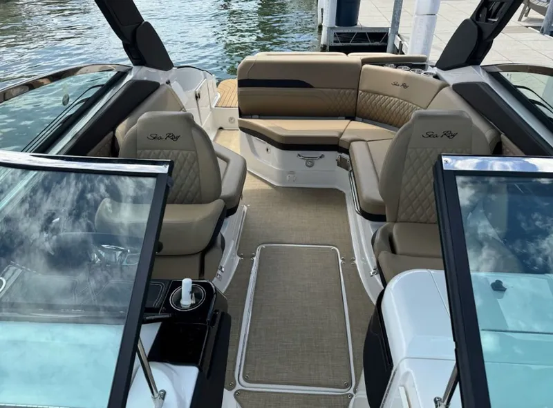 Slide: The Image of 2020 Sea Ray SLX 250 boat in a workshop on a trailer. - 3