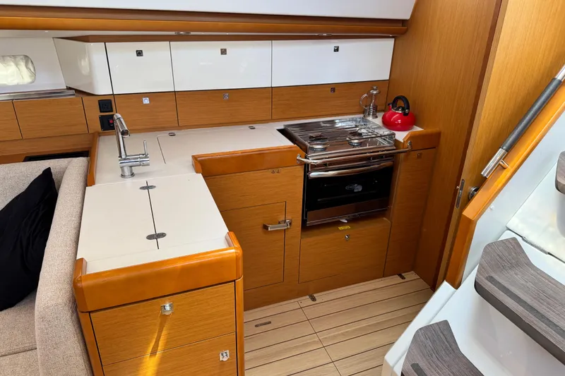Slide: The Image of Interior of 2020 Jeanneau Sun Odyssey 44 DS yacht kitchen with modern amenities. - 15