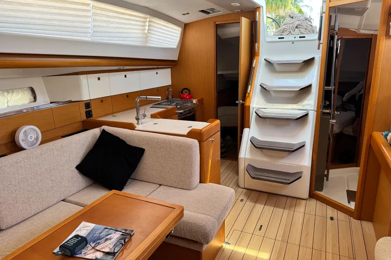 Slide: The Image of Interior of 2020 Jeanneau Sun Odyssey 44 DS yacht with modern kitchen and seating area. - 16