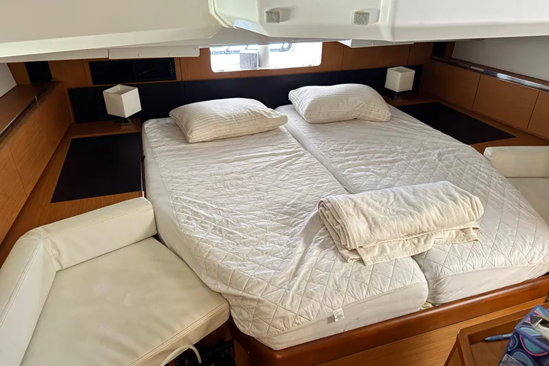 Slide: The Image of Interior cabin of 2020 Jeanneau Sun Odyssey 44 DS with double bed and modern decor. - 24