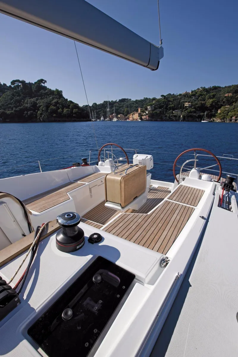 Slide: The Image of Manufacturer Provided Image: 2017 Jeanneau Sun Odyssey 44 DS sailboat deck with scenic coastal background. - 3