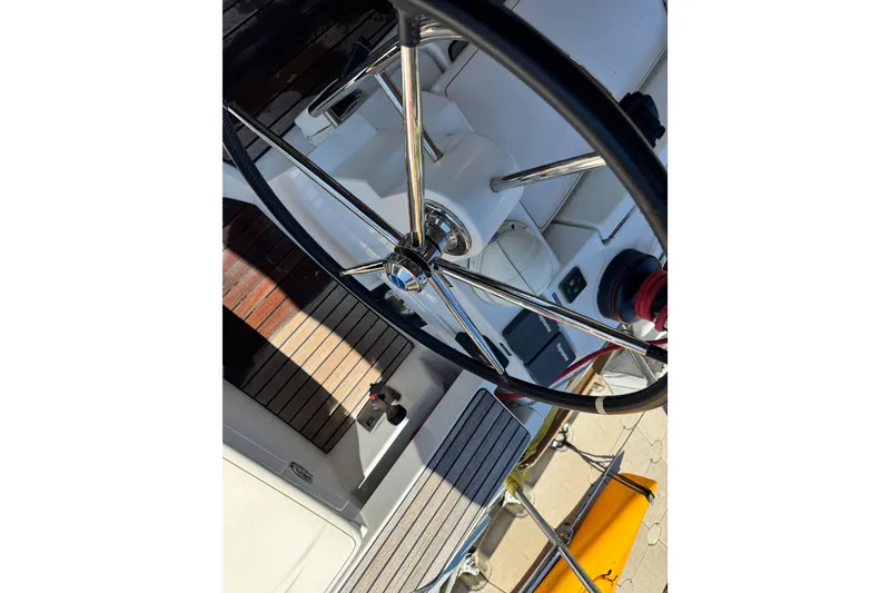 Slide: The Image of Steering wheel of 2020 Jeanneau Sun Odyssey 44 DS sailboat, showcasing cockpit details. - 9