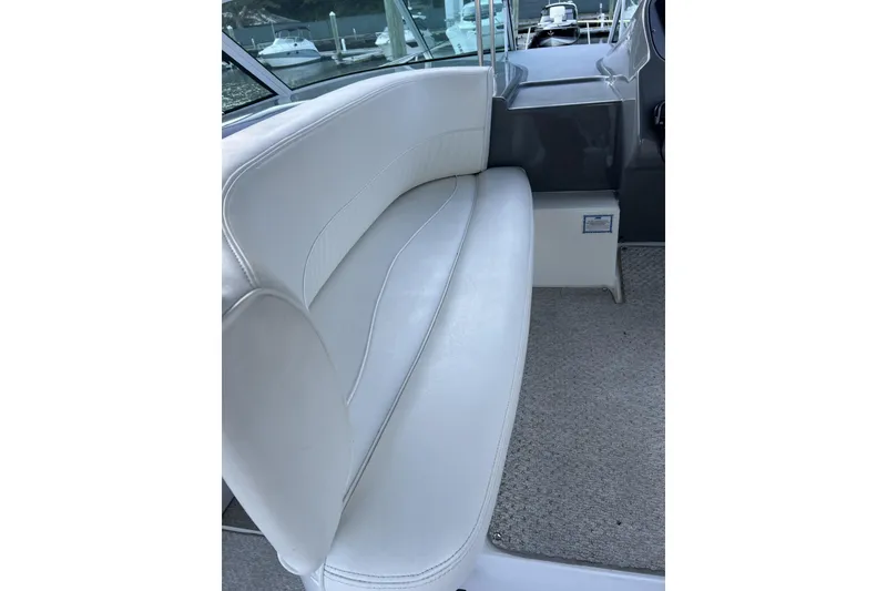 Slide: The Image of White leather seating on a 2005 Cruisers Yachts 370 Express boat interior. - 10