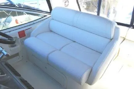 Slide: The Image of 2005 Cruisers Yachts 370 Express interior with white seating in cockpit area. - 12