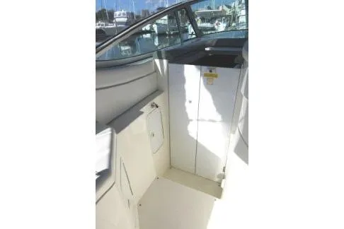 Slide: The Image of 2005 Cruisers Yachts 370 Express interior with seating and storage area. - 15