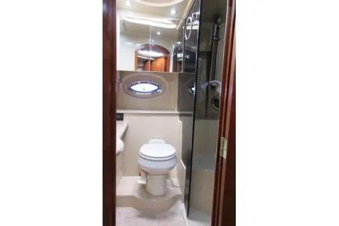 Slide: The Image of Bathroom interior of 2005 Cruisers Yachts 370 Express with modern fixtures. - 27