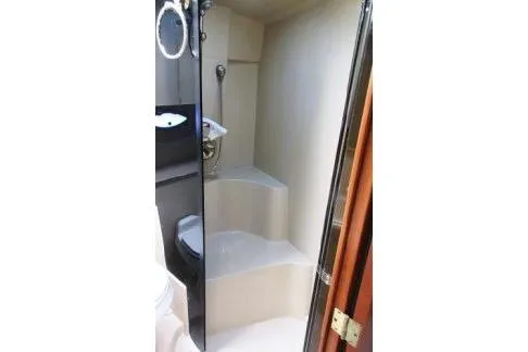 Slide: The Image of 2005 Cruisers Yachts 370 Express bathroom with shower and toilet. - 28