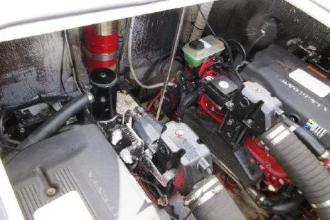Slide: The Image of Engine compartment of a 2005 Cruisers Yachts 370 Express, showcasing mechanical components. - 30