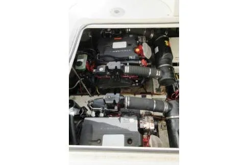 Slide: The Image of 2005 Cruisers Yachts 370 Express engine compartment with dual engines visible. - 31