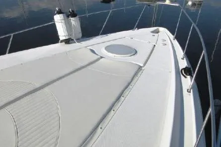 Slide: The Image of 2005 Cruisers Yachts 370 Express boat deck with railing and hatch. - 4