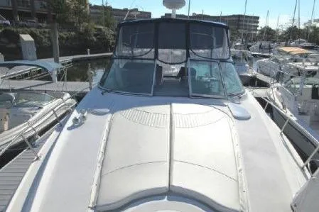 Slide: The Image of 2005 Cruisers Yachts 370 Express docked at marina, front deck view. - 5