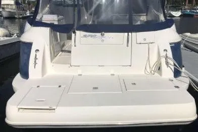 Slide: The Image of 2005 Cruisers Yachts 370 Express boat docked at marina. - 6