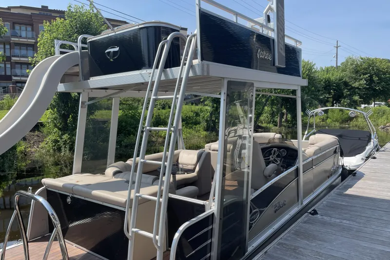 Slide: The Image of 2017 Tahoe Pontoon Cascade Platinum Funship Cruise with slide and upper deck at dock. - 2