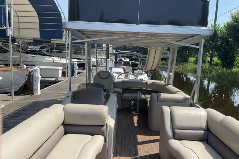Slide: The Image of 2017 Tahoe Pontoon Cascade Platinum Funship Cruise, docked with luxurious seating and upper deck slide. - 4
