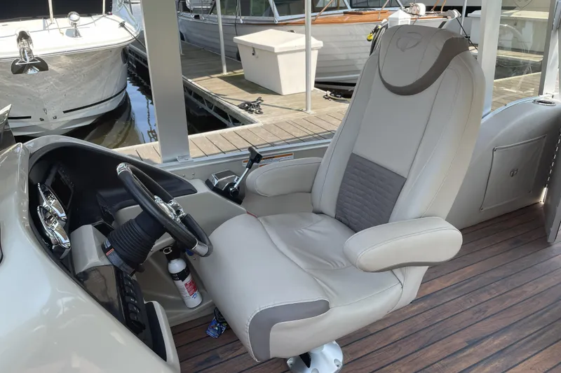 Slide: The Image of Captain's chair and helm of 2017 Tahoe Pontoon Cascade Platinum Funship Cruise, docked. - 6