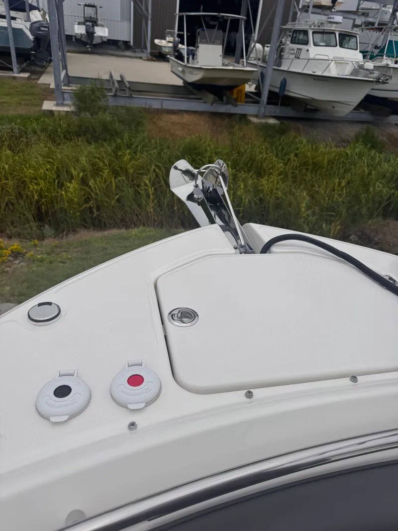 Slide: The Image of 2023 Robalo R247 Dual Console boat deck with anchor. - 15