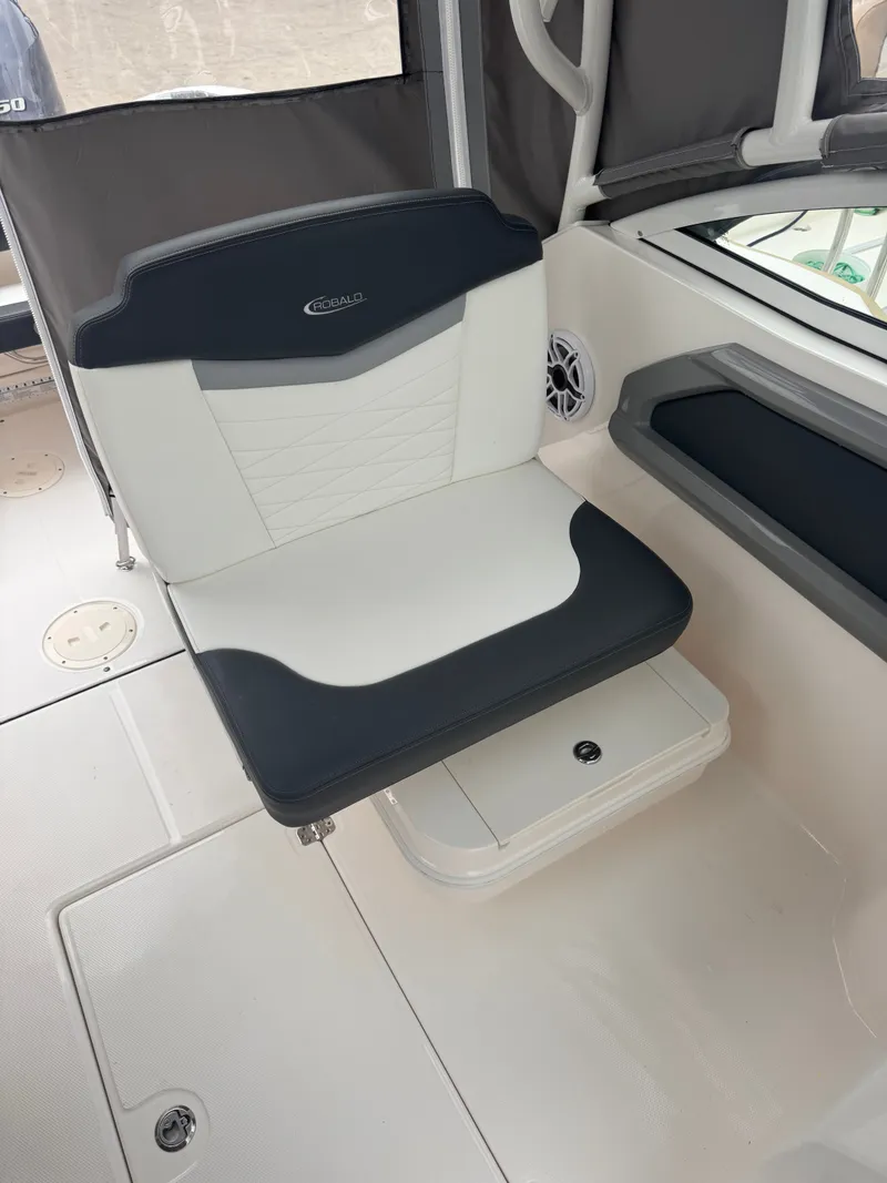 Slide: The Image of Seating area of the 2023 Robalo R247 Dual Console boat. - 22