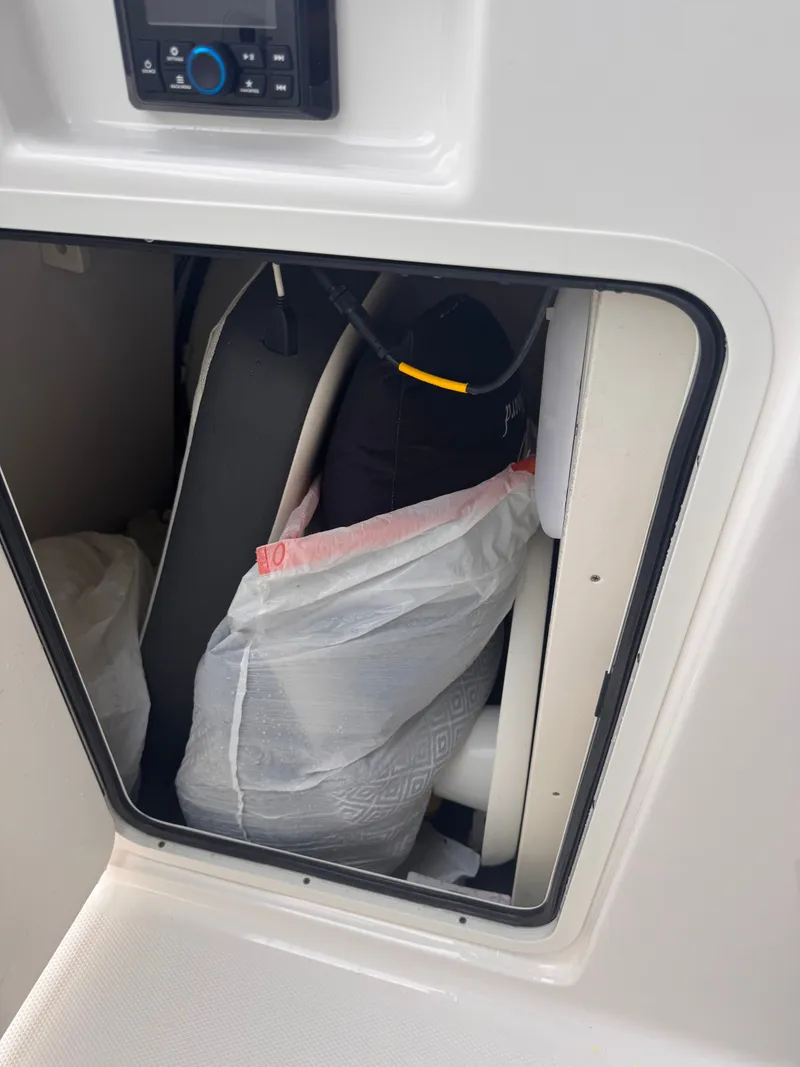 Slide: The Image of Storage compartment in Robalo R247 Dual Console boat, 2023 model. - 29