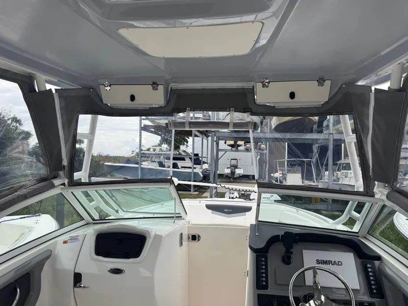 Slide: The Image of Interior view of 2023 Robalo R247 Dual Console boat. - 9
