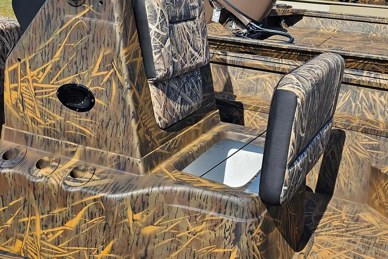 Slide: The Image of 2026 G3 Gator Tough 17 CC boat interior with camouflage design and seating. - 13