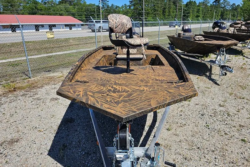 Slide: The Image of 2026 G3 Gator Tough 17 CC boat with camouflage design on a trailer. - 21