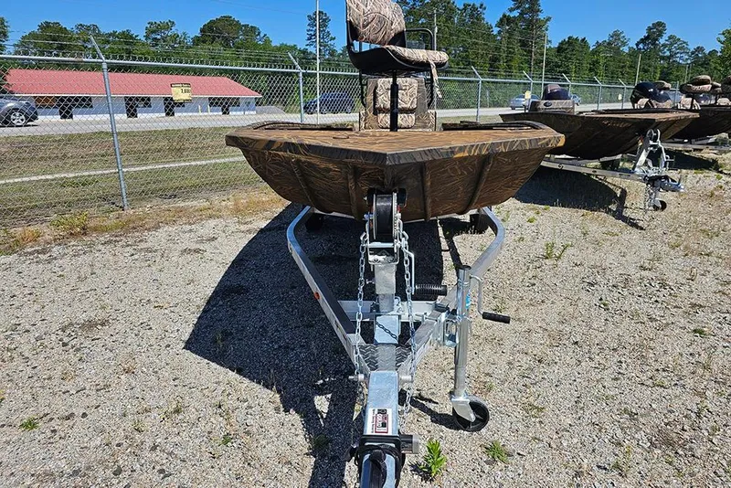 Slide: The Image of 2026 G3 Gator Tough 17 CC boat with camouflage design on a grassy field. - 22