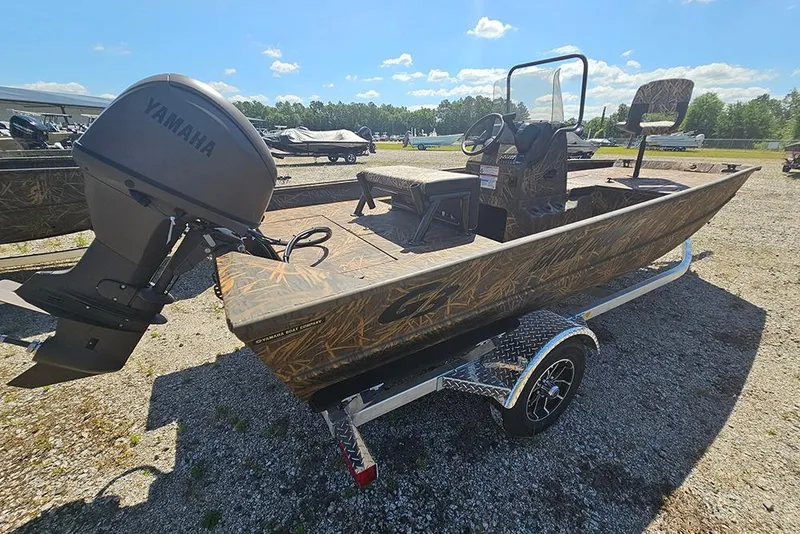 Slide: The Image of 2026 G3 Gator Tough 17 CC boat on trailer, camo design, outdoor display. - 25