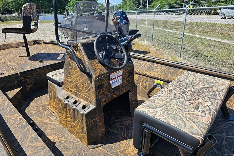 Slide: The Image of Open storage compartment of 2026 G3 Gator Tough 17 CC boat, showcasing interior details. - 27