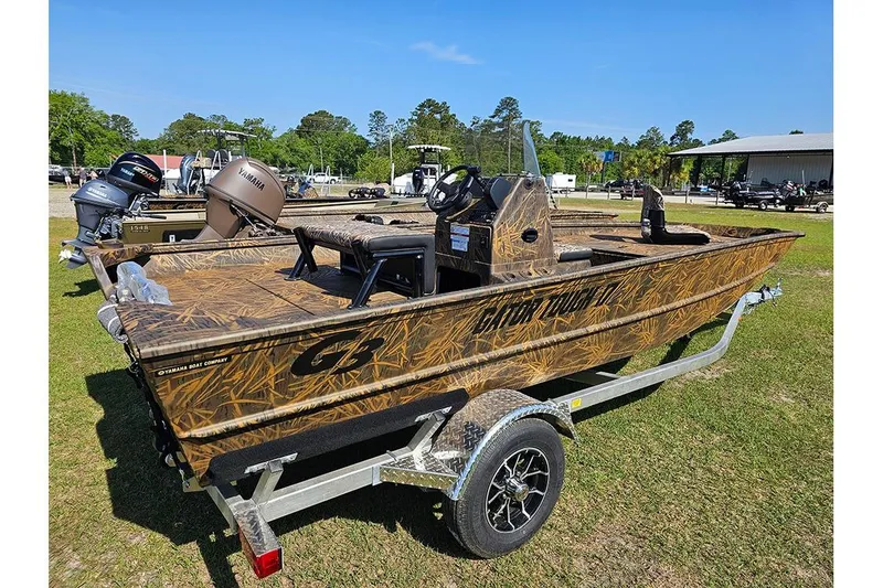 Slide: The Image of 2026 G3 Gator Tough 17 CC boat with camouflage design on a trailer. - 3