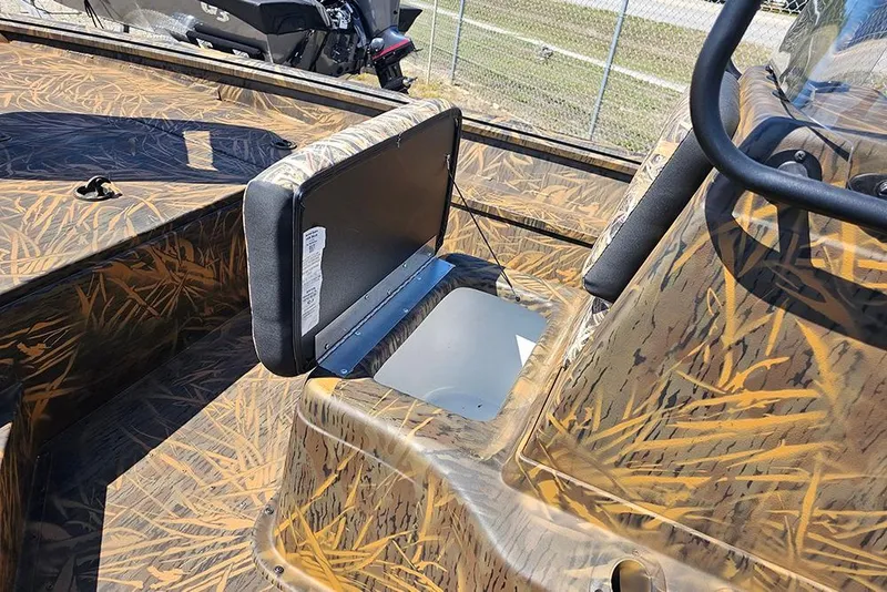 Slide: The Image of 2026 G3 Gator Tough 17 CC boat with camouflage interior, parked outdoors. - 30