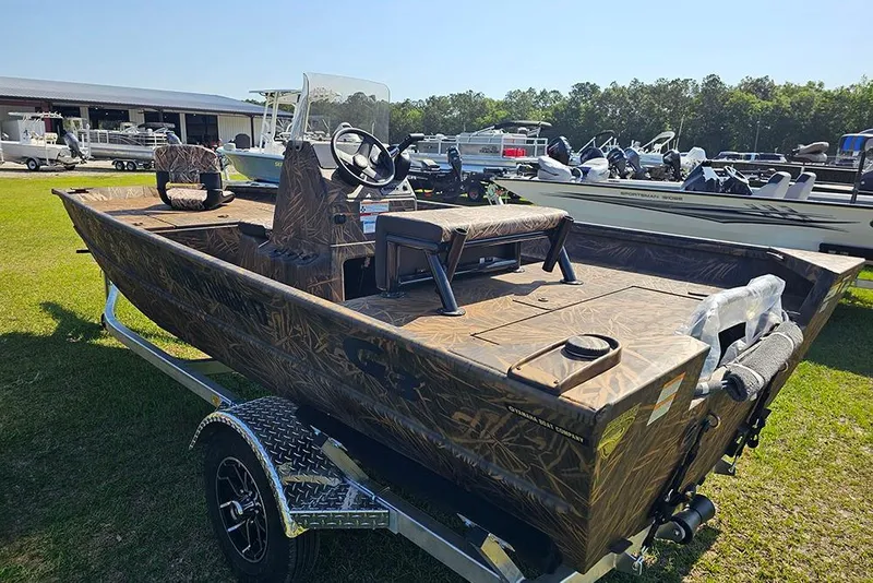 Slide: The Image of 2026 G3 Gator Tough 17 CC boat on trailer, camo design, outdoor display. - 7