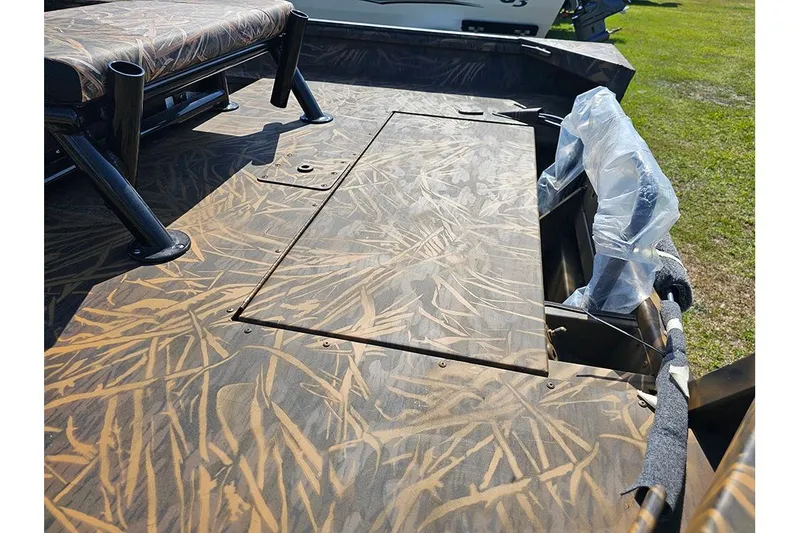 Slide: The Image of 2026 G3 Gator Tough 17 CC boat interior with camouflage pattern and seating. - 8