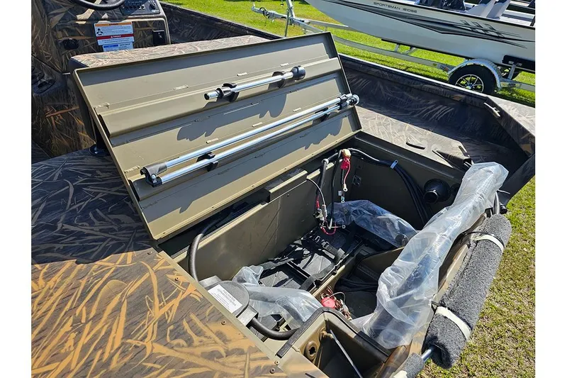 Slide: The Image of Open storage compartment of 2026 G3 Gator Tough 17 CC boat, showcasing interior details. - 9